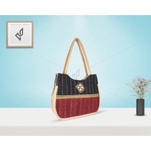 Hand Bag - An elegant jute handbag with an endearing piece work of cowrie shells on top (15 x 4 x 13 inches)