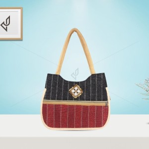 Hand Bag - An elegant jute handbag with an endearing piece work of cowrie shells on top (15 x 4 x 13 inches)
